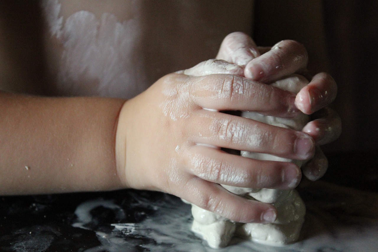 Hands Shaping Clay